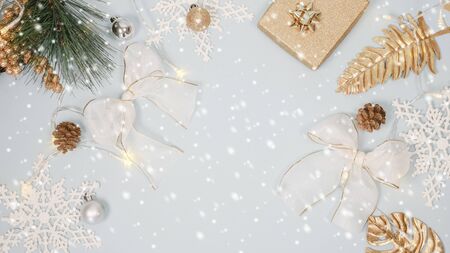 2020 Christmas and new year background banner with the beautiful decor gift for holiday in winter. On bright blue, golden and silver color theme with snow flake. top view with copy space.の写真素材