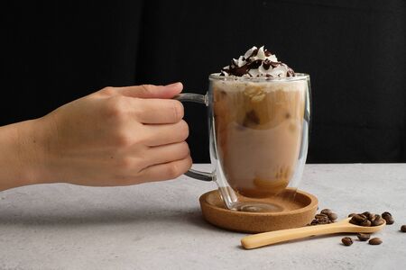 Coffee cup and beans top view with copyspace . flat lay latte for menu, background, banner and advertisement. brew caffeine drink and modern style.の写真素材