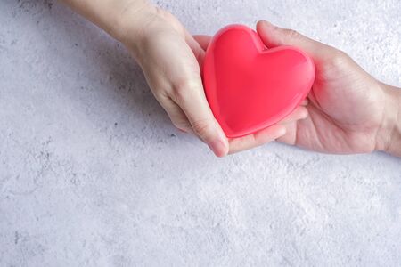 hand carrying heart .love and cardio health concept.valentine and wedding theme.の写真素材