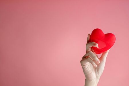 hand carrying heart .love and cardio health concept.valentine and wedding theme.の写真素材