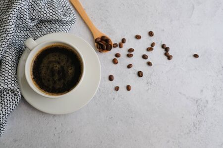 Coffee cup and beans top view with copyspace . flat lay espresso for menu, background, banner and advertisement. brew caffeine drink and modern style.の写真素材