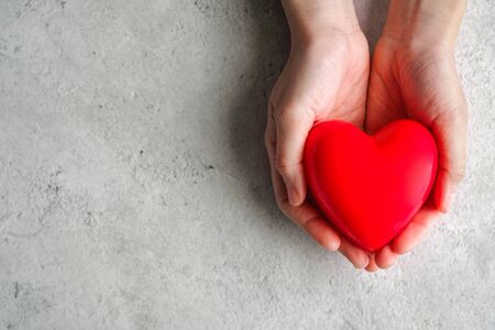 hand carrying heart .love and cardio health concept.valentine and wedding theme.の写真素材