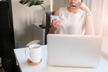 asian adult entrepreneur work on laptop and mobile phone with paperwork in the smart office.の写真素材