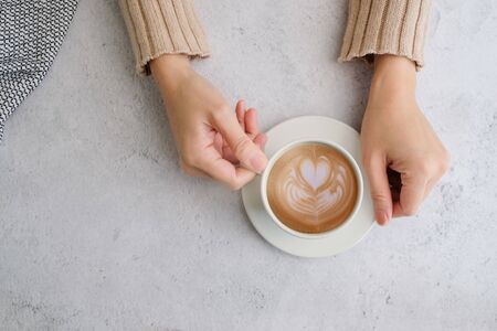Coffee cup and beans top view with copyspace . flat lay latte for menu, background, banner and advertisement. brew caffeine drink and modern style.の写真素材