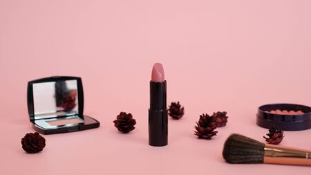beautiful lipstick makeup cosmetic on pink background with makeup set.の写真素材