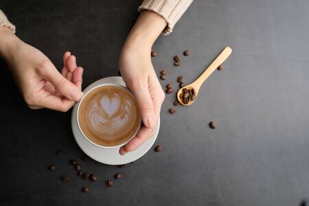 Coffee cup and beans top view with copyspace . flat lay latte for menu, background, banner and advertisement. brew caffeine drink and modern style.の写真素材