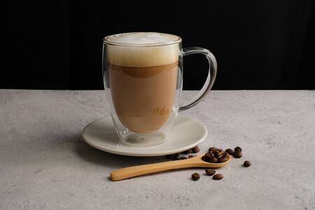 Coffee cup and beans top view with copyspace . flat lay latte for menu, background, banner and advertisement. brew caffeine drink and modern style.の写真素材