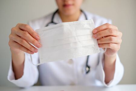lady or woman doctor wear the medical mask to protect infection from germ, bacteria, covid19, corona , sars , influenza virus.の写真素材