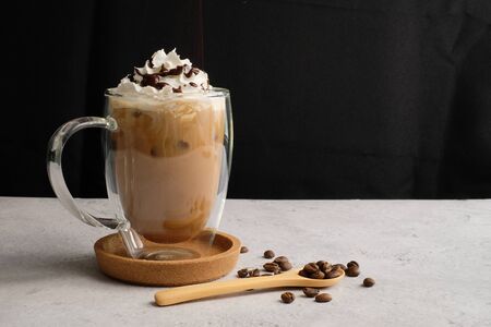 Coffee cup and beans top view with copyspace . flat lay latte for menu, background, banner and advertisement. brew caffeine drink and modern style.の写真素材