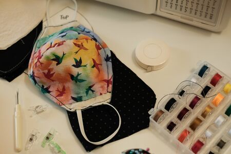 sewing home made mask to prevent corona virus , covid 19.の写真素材