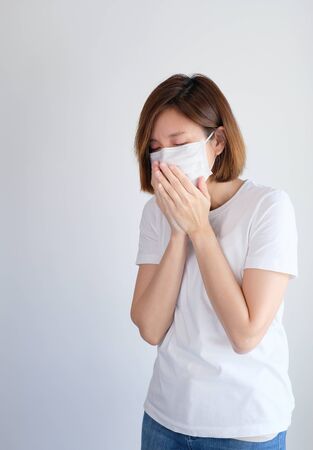 woman wearing mask and cannot breath get sick from corona virus, covid19, flu symptom .の写真素材