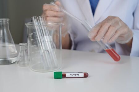 medicine and vaccine research and development in the laboratory. Test by the doctor or scientist for treatment the corona virus, covid19, influenza and bacteria.の写真素材