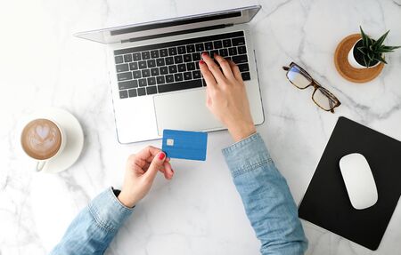 woman shopping online and pay with the blue credit card. flat lay and modern style.の写真素材