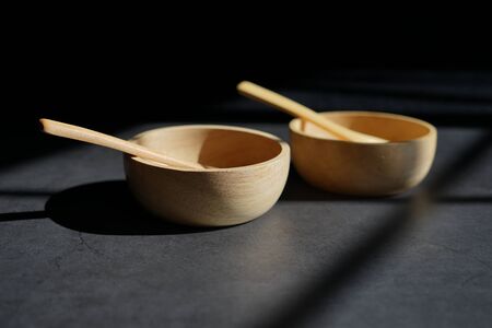 bamboo food bowl container with wood spoon.の写真素材