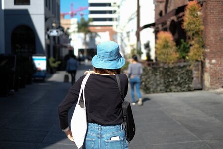 woman carry the re useable plastic free bag. eco friendly and sustainability life. hipster and minimal lifestyle to save the green earth and environment . trees background.の写真素材