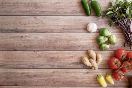 fresh vegetable on wooden background in the kitchen.の写真素材