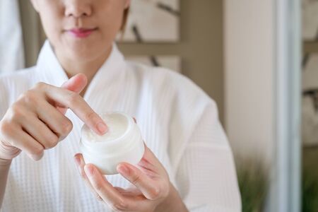 woman apply cosmetic beauty cream.skincare concept.の写真素材