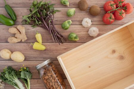 blank wood box for plastic free grocery delivery of fresh vegetable product.の写真素材