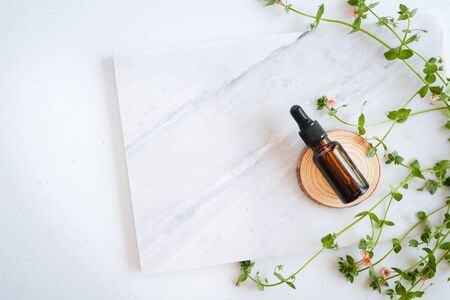 natural skincare on marble background with flower, leaf and pestle mortar . cosmetic beauty background.の写真素材
