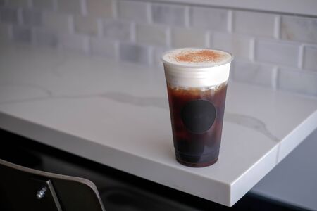 ice coffee sea salt cream on the cafe bar table.の写真素材