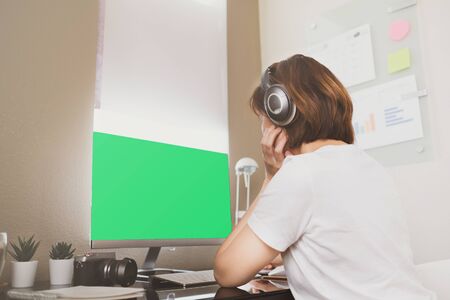 college student video call for online class and learning remote. computer laptop green screen.の写真素材