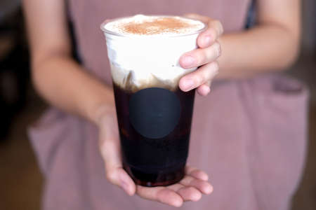 barista hold and serve the ice with creamの写真素材