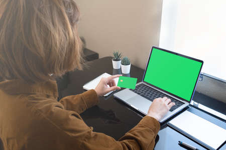 woman shopping online by computer and pay by credit card.の写真素材