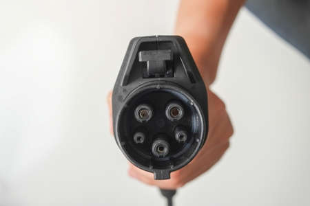 black car charger isolated . ev electric vehicle for environment.の写真素材