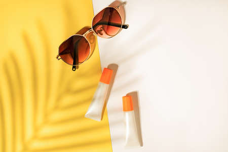 Beauty cosmetic product on flatlay background . Skincare for summer and travel.