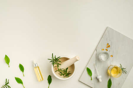 The herbal capsule gel with the crude oil and dropper on white background.の写真素材