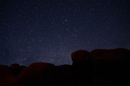 The night sky at arches national park .