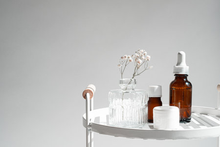 The natural skincare bottle is on the white shelf in the bathroom for self-care and beauty concept. Selective focusの写真素材