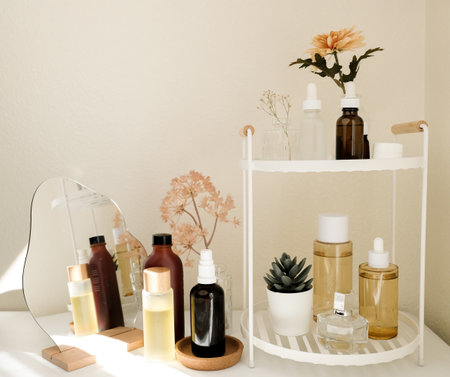 The beauty product and skincare set on the bath shelf with luxury flower and mirror for spa concept.の写真素材