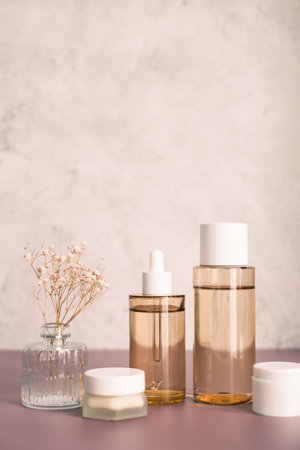 skincare set of dropped bottle , jar and toner. self care and cosmetic concept . Vertical beauty background with copy space.の写真素材