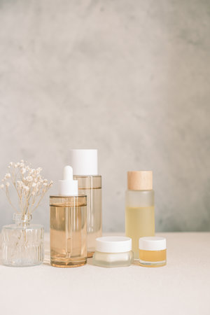 skincare set product with flower in the bathroom with copy space. verticalの写真素材