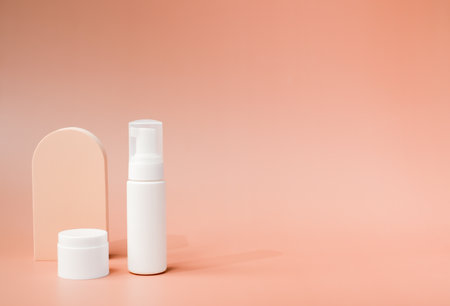 beauty product and mock-up skincare container on a pastel display background with copy space.の写真素材