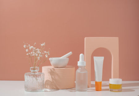 Skincare and beauty product on pastel background with flower.の写真素材