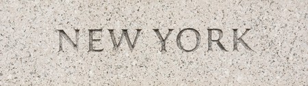 New York state name written in grey granite stoneの写真素材