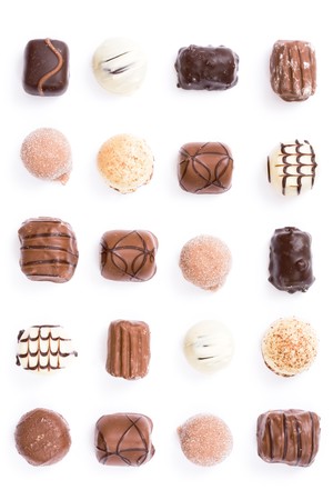Chocolates in a uniform pattern isolated on whiteの写真素材