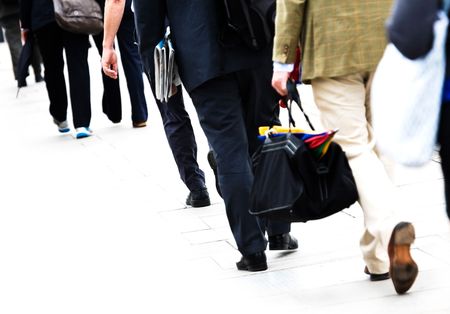 Commuters in casual business dress walk to work, isolated on white background Commuters in casual business dress walk to work, isolated on white background