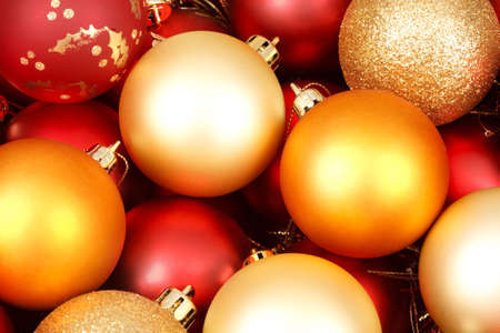 Colorful christmas ornaments in red and goldの写真素材