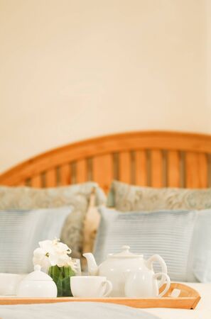 Tea tray on a bed with plenty of copyspace at topの写真素材