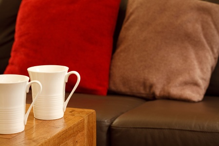 Detail of a stylish coffee house with sofa and mugs. Plenty of space for textの写真素材