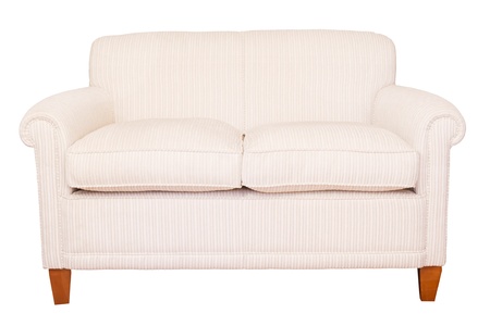 Modern neutral cream sofa isolated against a white background with clipping path Modern neutral cream sofa isolated against a white background with clipping path