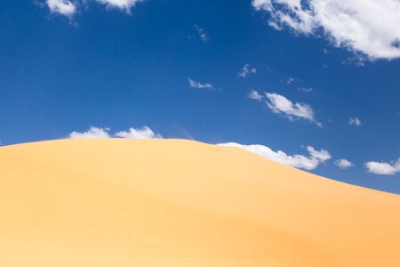 Scenic of a desert landscape with a sand duneの写真素材