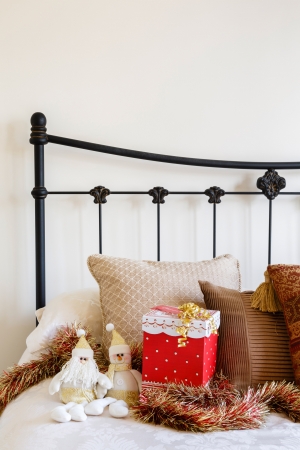 Christmas interior of contemporary bed against a neutral wallの写真素材
