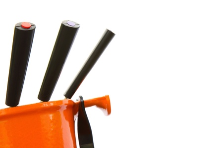 Orange fondue against a white background with copy space.の写真素材