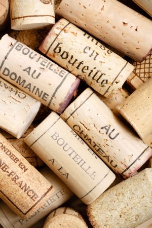Selection of used wine corks in a pile, ideal for a backgroundの写真素材