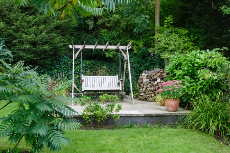 Back garden and patio with furniture in a British homeの写真素材