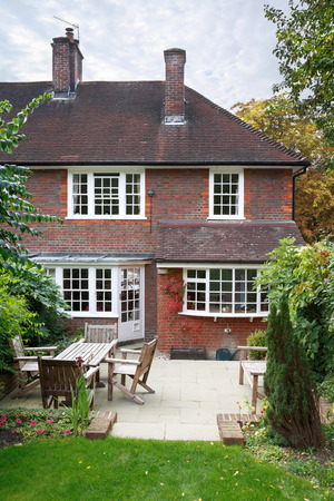 Back of a traditional 1930's English house and gardenの写真素材